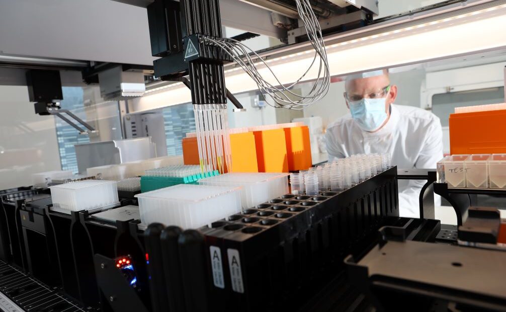 Press Principal scientist Simon looking through equipment